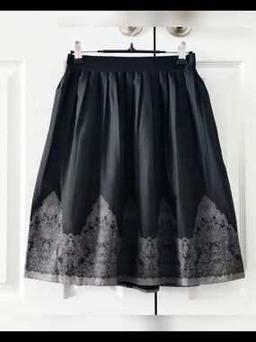 Axes Femme - Pleated Black Skirt with Gray Filigree Design